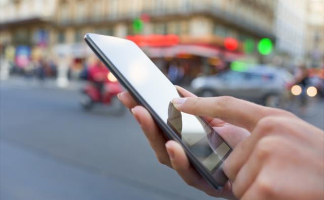 Person using a smart-phone Person using a smart-phone